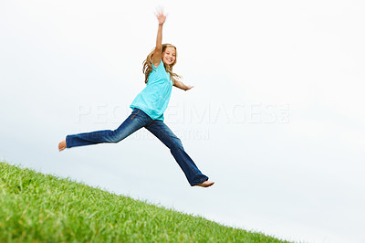 Portrait of happy girl jumping with hands raised