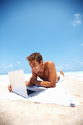 Relaxed man working on laptop