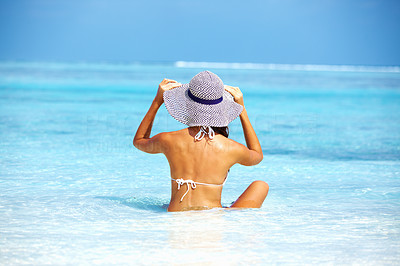 Woman relaxing in sun hat