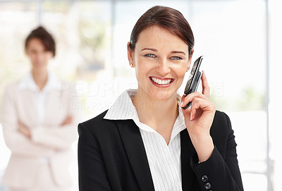 Happy young business woman over the cellphone