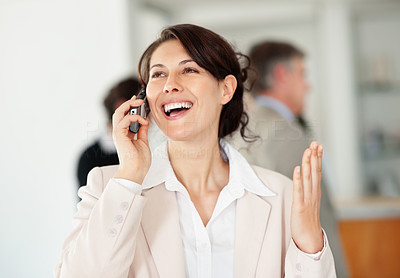 Happy middle aged business female over the cellphone
