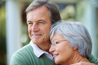 Mature couple looking away in thought