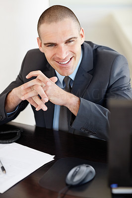 Happy middle aged business man smiling in office