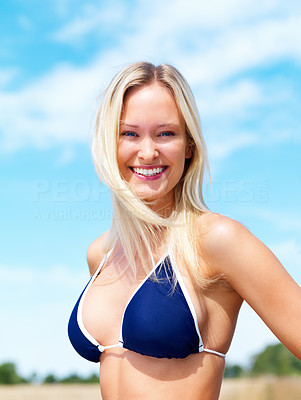 Portrait of a happy woman in blue bikini bra