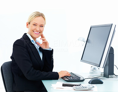 Happy business woman working on a computer isolated at white background
