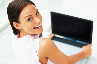 Beautiful lady holding laptop and looking backward