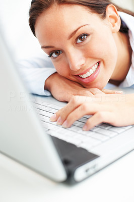 Closeup of cute young lady with a laptop