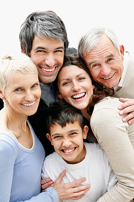 Cheerful loving multi generational family smiling together
