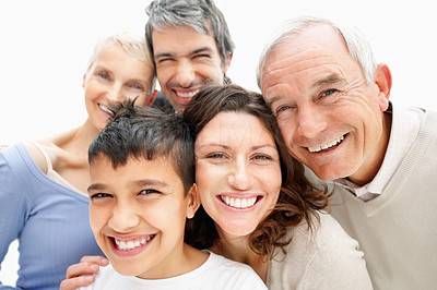 Closeup of a cheerful extended family smiling together
