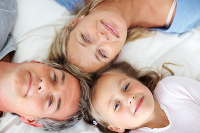Top view - Sweet family lying together on the bed