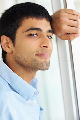 Closeup of a Caucasian young guy thinking about the future
