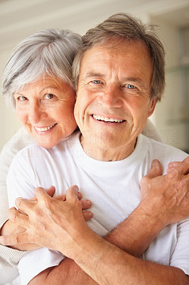 Affectionate elderly couple hugging each other