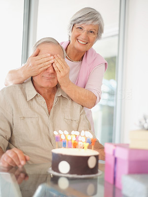Birthday surprise - Senior woman covering husband\'s eyes