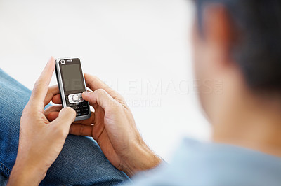 Closeup of normal guy typing text message on mobile phone