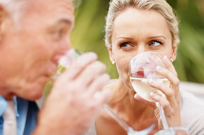 Closeup of a happy couple drinking wine outdoors