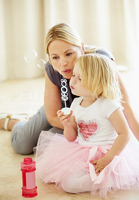 Blowing bubbles with mum