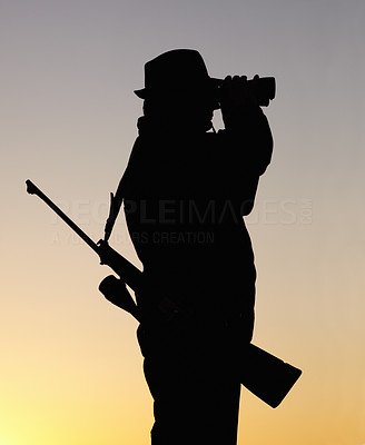 A silhouette of a hunter