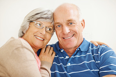 Closeup of a romantic senior wife hugging her husband
