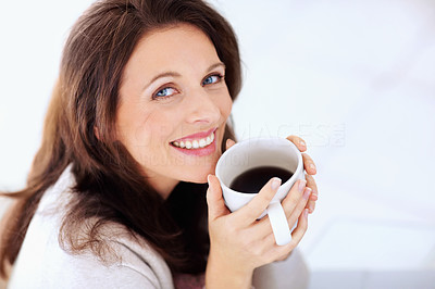 Portrait of a happy mature woman having coffee