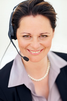 Closeup portrait of a happy business woman using a headset