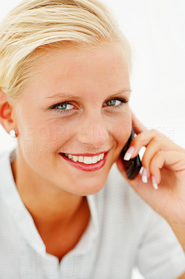 Closeup portrait of a lovely blond speaking on cellphone
