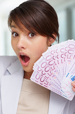 Surprised - Female with fan of five hundred Euros