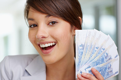 Closeup of a woman with currency notes , fan of notes