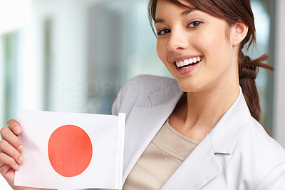 Pretty young lady with a Japanese flag