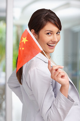 Beautiful young woman with a Chinese flag