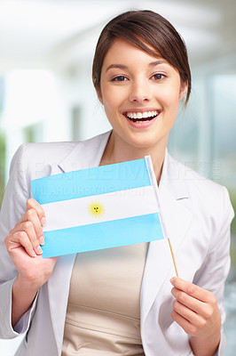 Portrait of a cute woman with Argentina´s flag