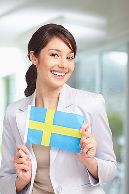 Pretty woman holding a swedish flag