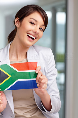 Beautiful young female with a South African flag