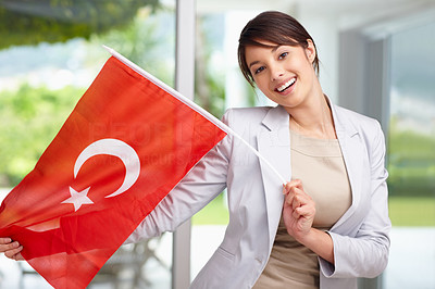 Beautiful young woman displaying a Turkish flag