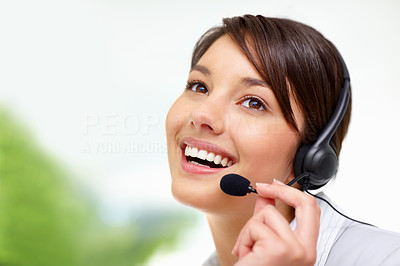 Female call centre employee speaking on headset