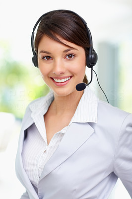 Cute young female call centre employee smiling