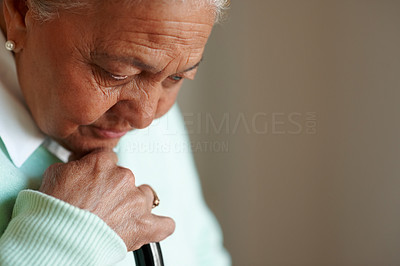 Worried elderly woman , thinking