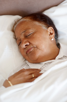 Senior woman asleep in bed