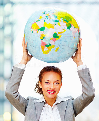 Cute young business woman holding a globe