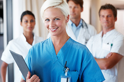 Smiling nurse holding patient file