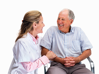 Happy nurse with a smiling senior man sitting on chair