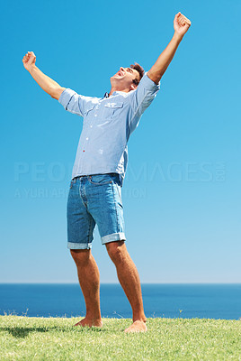 Man in park with arms wide open