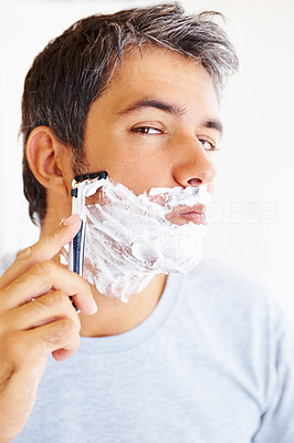 Closeup: Mature man shaving his beard