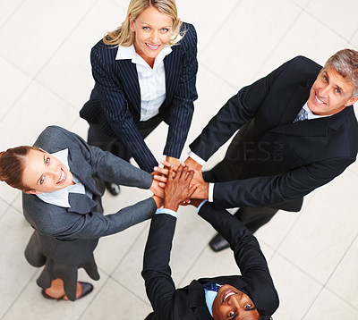 Confident happy business people with their hands together