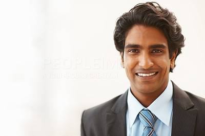 Confident young business man smiling over white background