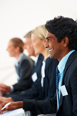 Young business student at a seminar with colleagues