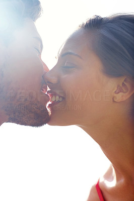 Portrait of a romantic happy young couple kissing