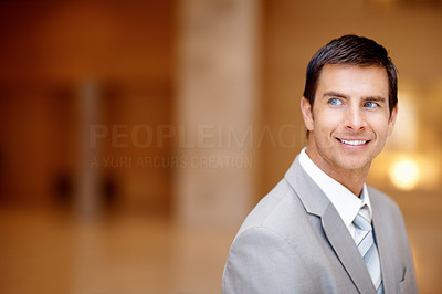 Handsome business man looking away and smiling