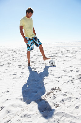 Full length image of a beach soccer player