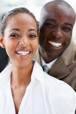 Two African American business people laughing together