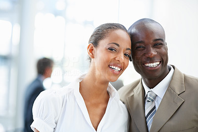 Pretty African American business people smiling together